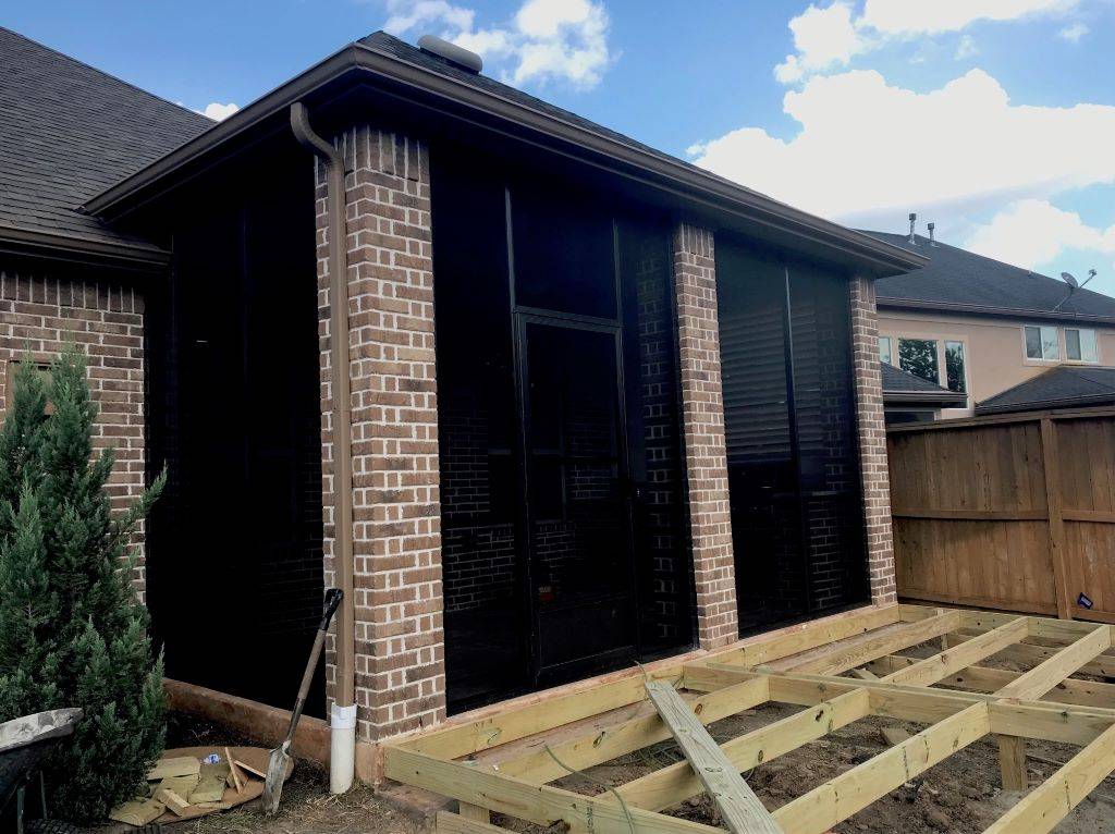 Patio Enclosure in San Antonio with screen walls and a deck.